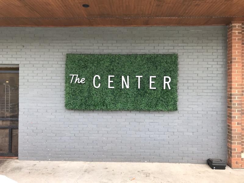 Interior office sign of The Center