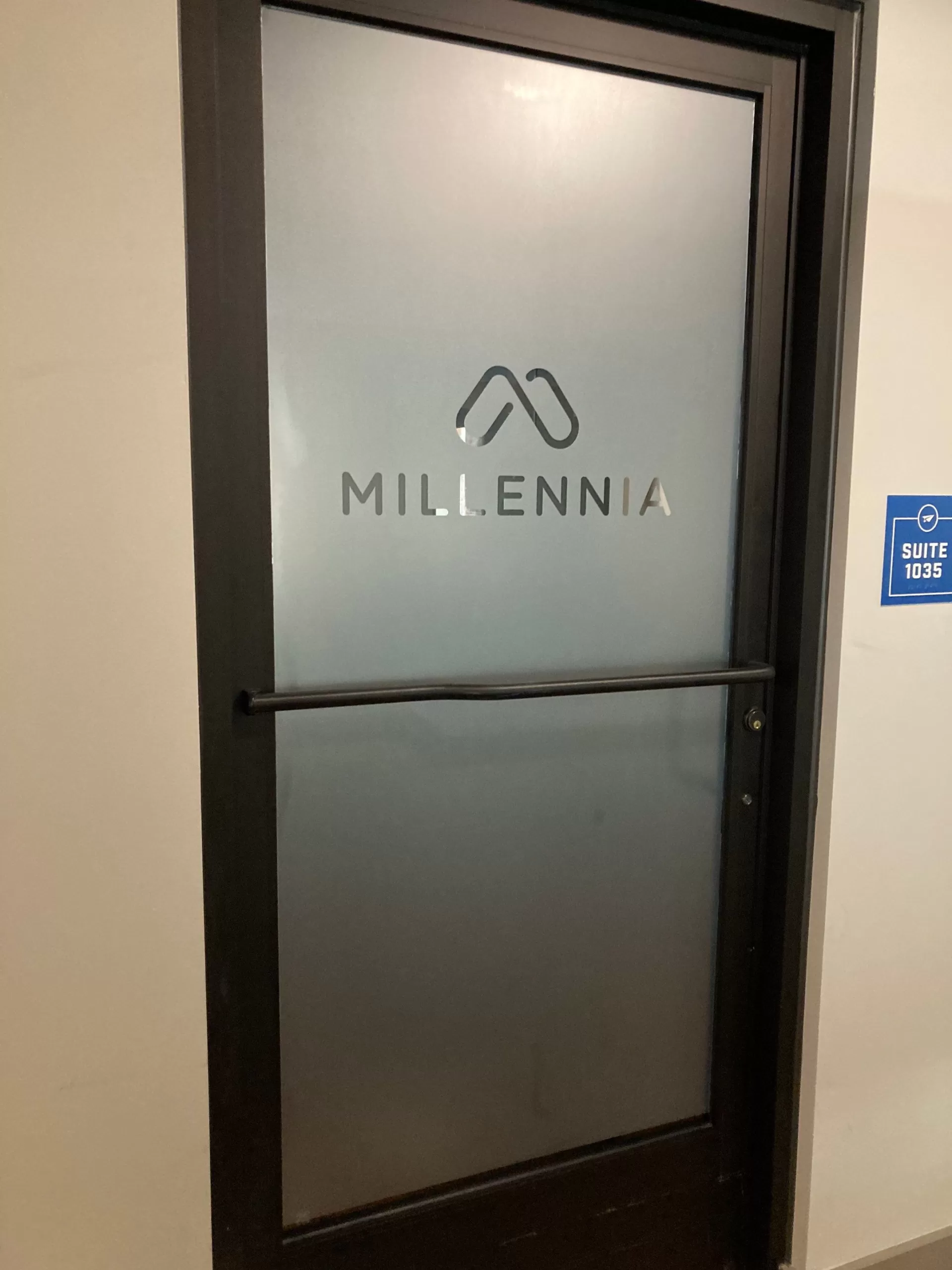 Frosted Vinyl With Cut Logo Of Millennia Designed By Elite Custom Signs In Raleigh