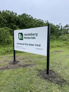 Post And Panel Sign Of City Sales Yard